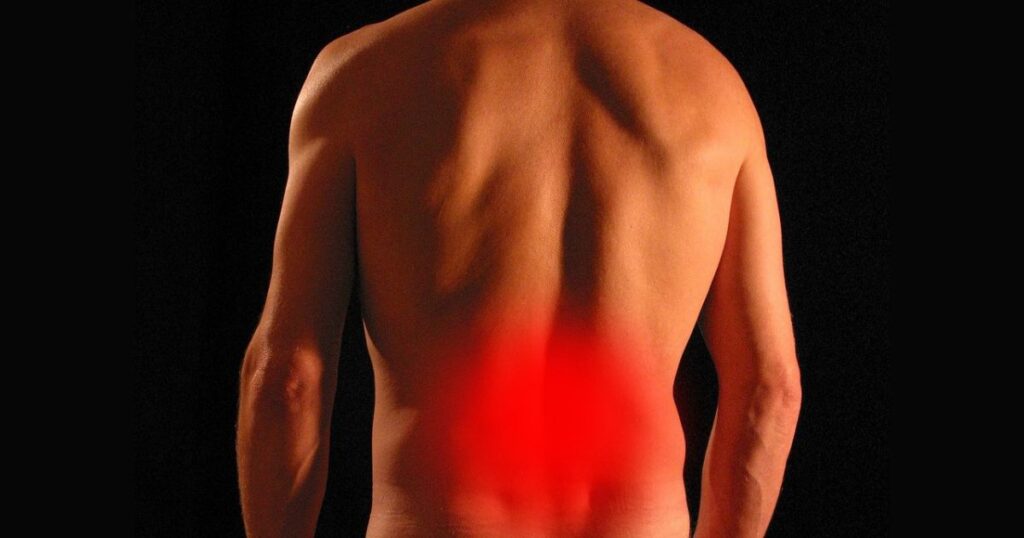 Lower back pain relief image highlighting the affected area in red